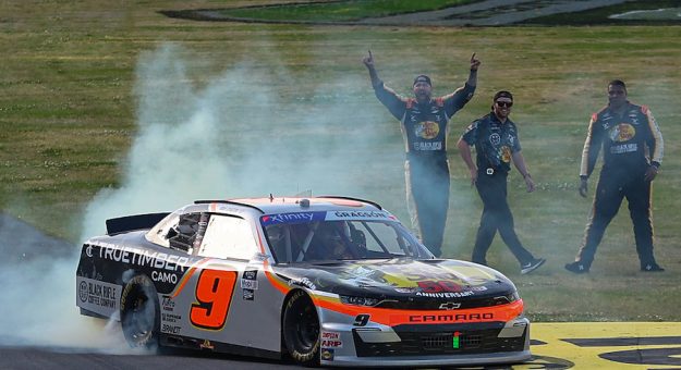 TALLADEGA, ALABAMA - APRIL 23: Noah Gragson, driver of the #9 Bass Pro Shops/TrueTimber/BRCC Chevrolet, celebrates with a burnout after winning the NASCAR Xfinity Series Ag-Pro 300 at Talladega Superspeedway on April 23, 2022 in Talladega, Alabama. (Photo by James Gilbert/Getty Images)