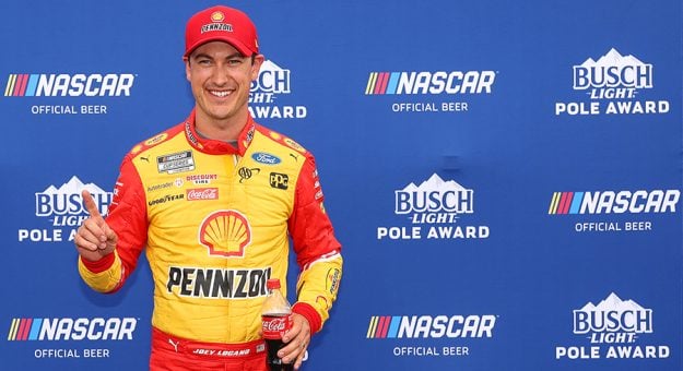 DARLINGTON, SOUTH CAROLINA - MAY 07: Joey Logano, driver of the #22 Shell Pennzoil Ford, poses for photos after winning the pole award during qualifying for the NASCAR Cup Series Goodyear 400 at Darlington Raceway on May 07, 2022 in Darlington, South Carolina. (Photo by James Gilbert/Getty Images) | Getty Images