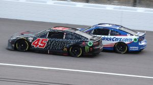 May 15, 2022:  Kurt Busch passes Kyle Larson for the win during the Advent Health 400 at the Kansas Speedway.  (HHP/Tom Copeland)