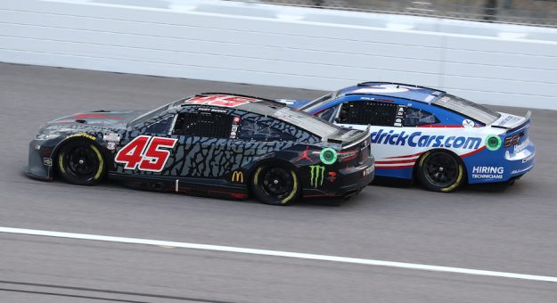 May 15, 2022:  Kurt Busch passes Kyle Larson for the win during the Advent Health 400 at the Kansas Speedway.  (HHP/Tom Copeland)