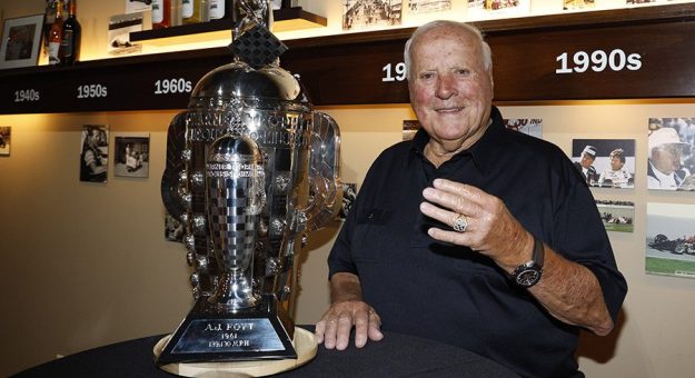 4-time Indy 500 Winner AJ Foyt receives a baby Borg-Warner trophy from Michelle Collins of BorgWarner