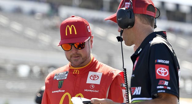 LONG POND, PENNSYLVANIA - JULY 23: Kurt Busch, driver of the #45 McDonald's Toyota, works with a crew member during qualifying for the NASCAR Cup Series M&M's Fan Appreciation 400 at Pocono Raceway on July 23, 2022 in Long Pond, Pennsylvania. (Photo by Logan Riely/Getty Images) | Getty Images