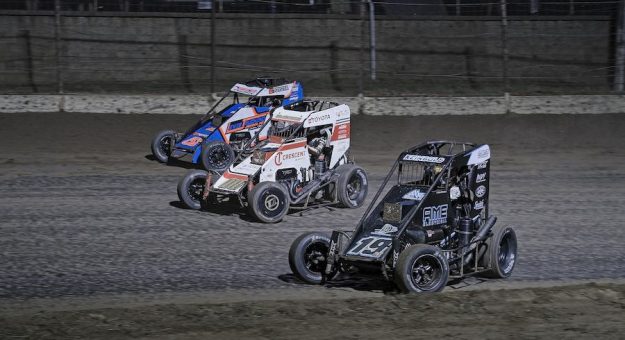 Cannon McIntosh (08) slices thru the field putting Hayden Rienbold (19AZ) and Joe B. Miller (51B) a lap down during the John Hink Championship,  presented by Dahmer Powertrain,  at Sweet Springs Motorsports Complex in Sweet Springs, Missouri.