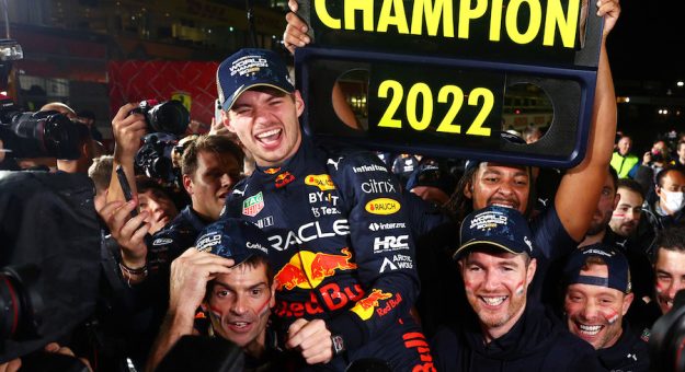 SUZUKA, JAPAN - OCTOBER 09: Race winner and 2022 F1 World Drivers Champion Max Verstappen of Netherlands and Oracle Red Bull Racing celebrates with his team after the F1 Grand Prix of Japan at Suzuka International Racing Course on October 09, 2022 in Suzuka, Japan. (Photo by Clive Rose/Getty Images) // Getty Images / Red Bull Content Pool // SI202210090535 // Usage for editorial use only // | Getty Images