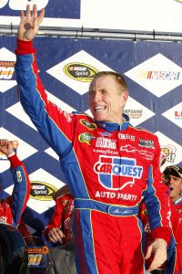 LOUDON, NH - SEPTEMBER 20:  Mark Martin, driver of the #5 CARQUEST/Kellogg's Chevrolet, celebrates in victory lane after winnng the NASCAR Sprint Cup Series Sylvania 300 at the New Hampshire Motor Speedway on September 20, 2009 in Loudon, New Hampshire.  (Photo by Geoff Burke/Getty Images for NASCAR) | Getty Images
