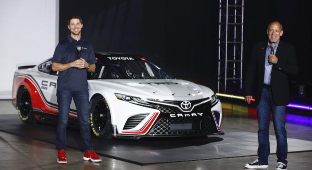 CHARLOTTE, NORTH CAROLINA - MAY 05: NASCAR driver Denny Hamlin and Toyota Racing Development USA President and General Manager David Wilson speak at the unveiling of the seventh generation of the NASCAR Cup Series Toyota car during the NASCAR Next Gen Car Announcement on May 05, 2021 in Charlotte, North Carolina. (Photo by Jared C. Tilton/Getty Images) | Getty Images