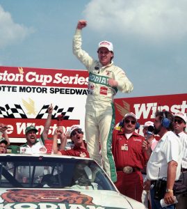 CONCORD, NC - MAY 21:  Driver Rusty Wallace holds his fist up in triumph after winning the 1989 The Winston race on May 21, 1989 at the Charlotte Motor Speedway in Concord, North Carolina. (Photo by Dozier Mobley/Getty Images)