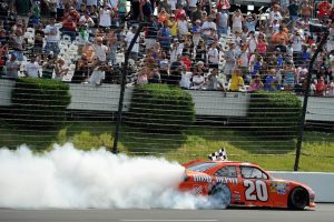 LONG POND, PA - JUNE 10:  Joey Logano, driver of the #20 The Home Depot Toyota, celebrates with a burnout after winning the NASCAR Sprint Cup Series Pocono 400 presented by #NASCAR at Pocono Raceway on June 10, 2012 in Long Pond, Pennsylvania.  (Photo by Drew Hallowell/Getty Images) | Getty Images