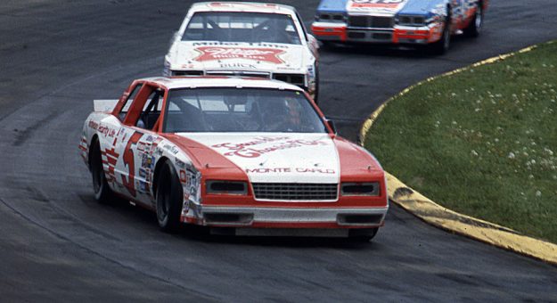 MARTINSVILLE, VA — April 29, 1984:  Geoff Bodine leads Bobby Allison and Richard Petty during the Sovran Bank 500 NASCAR Cup race at Martinsville Speedway.  Bodine went on to win the event, his first career Cup win as well as the first Cup victory for his car owner Rick Hendrick.  (Photo by ISC Images & Archives via Getty Images)