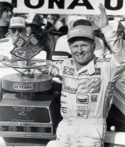 DAYTONA BEACH, FL -  FEBRUARY 19:  Cale Yarborough celebrates in Victory Lane after winning the Daytona 500.  Yarborough would take home $160,300 for the race.   (Photo by Racing Photo Archives/Getty Images)